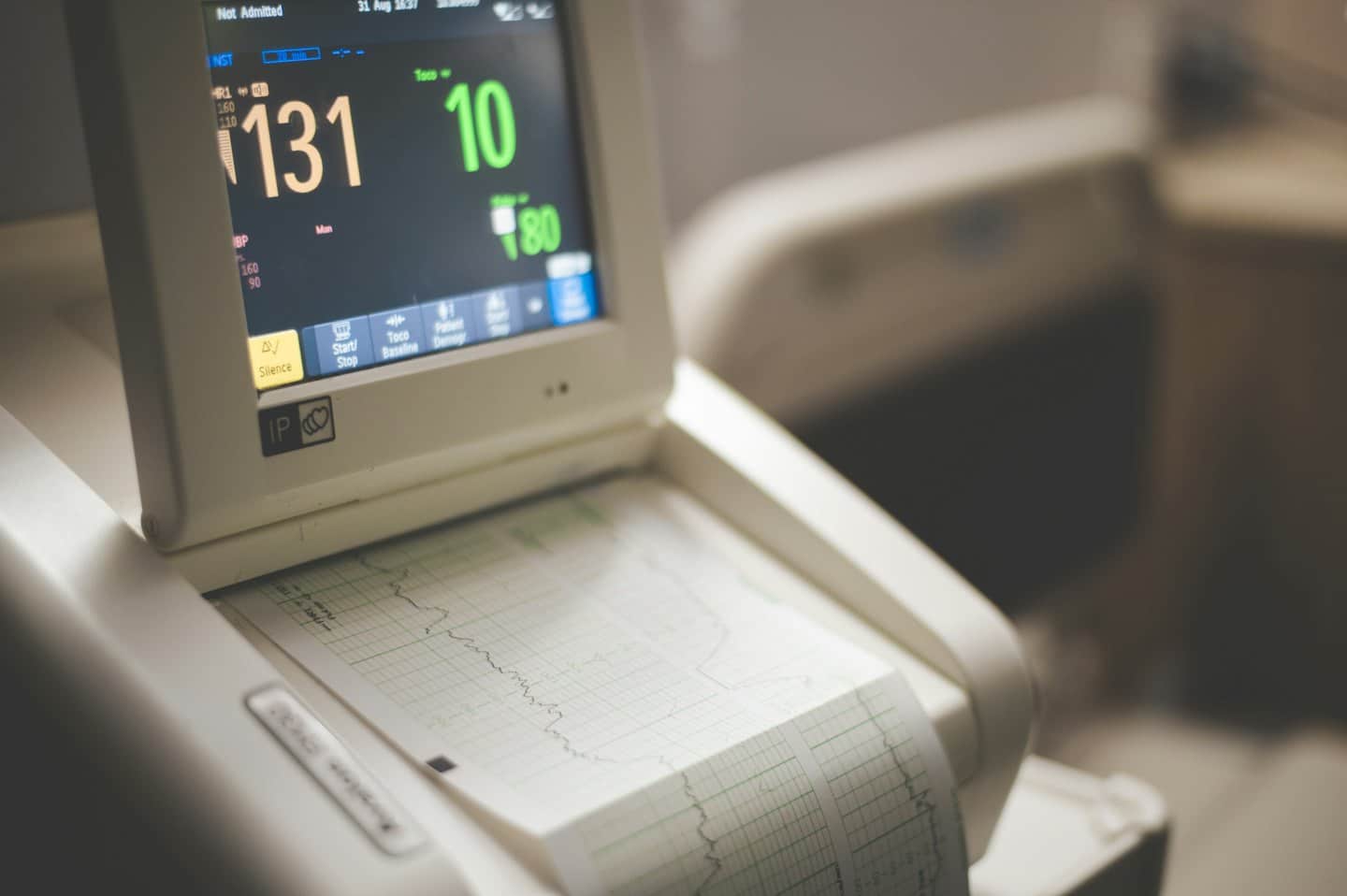 Medical monitoring device displays patient vital signs.